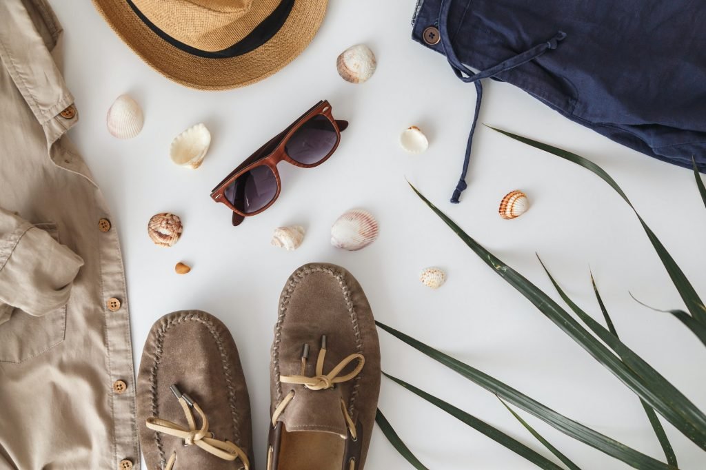 Male hipster fashion accessories on white. Flat lay, vacation and travel items