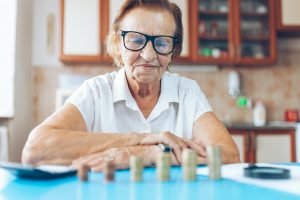 Senior woman checking her finances and investments