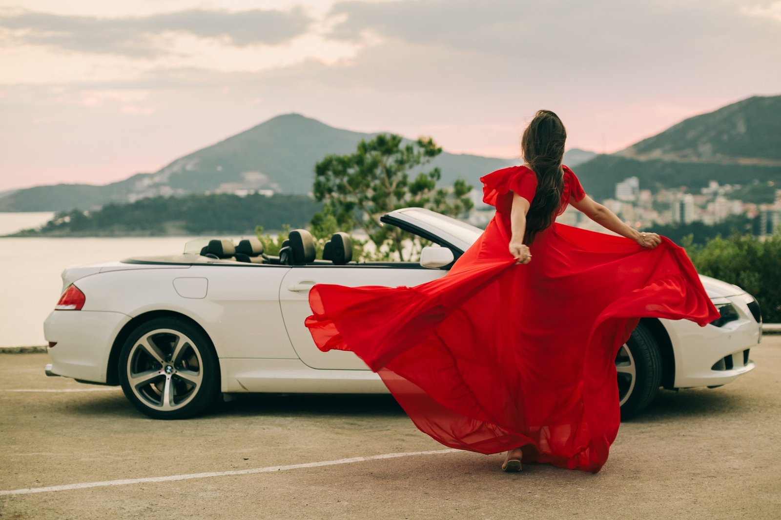 woman in dress travel by car