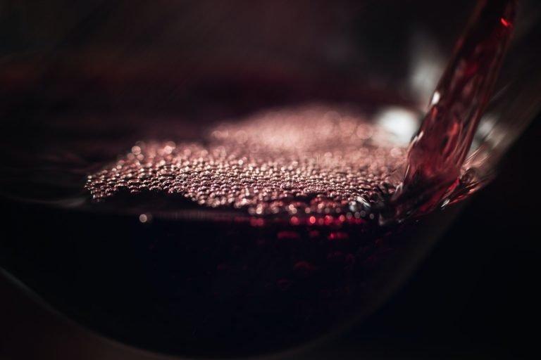 Red Wine Pouring Into Wine Glass