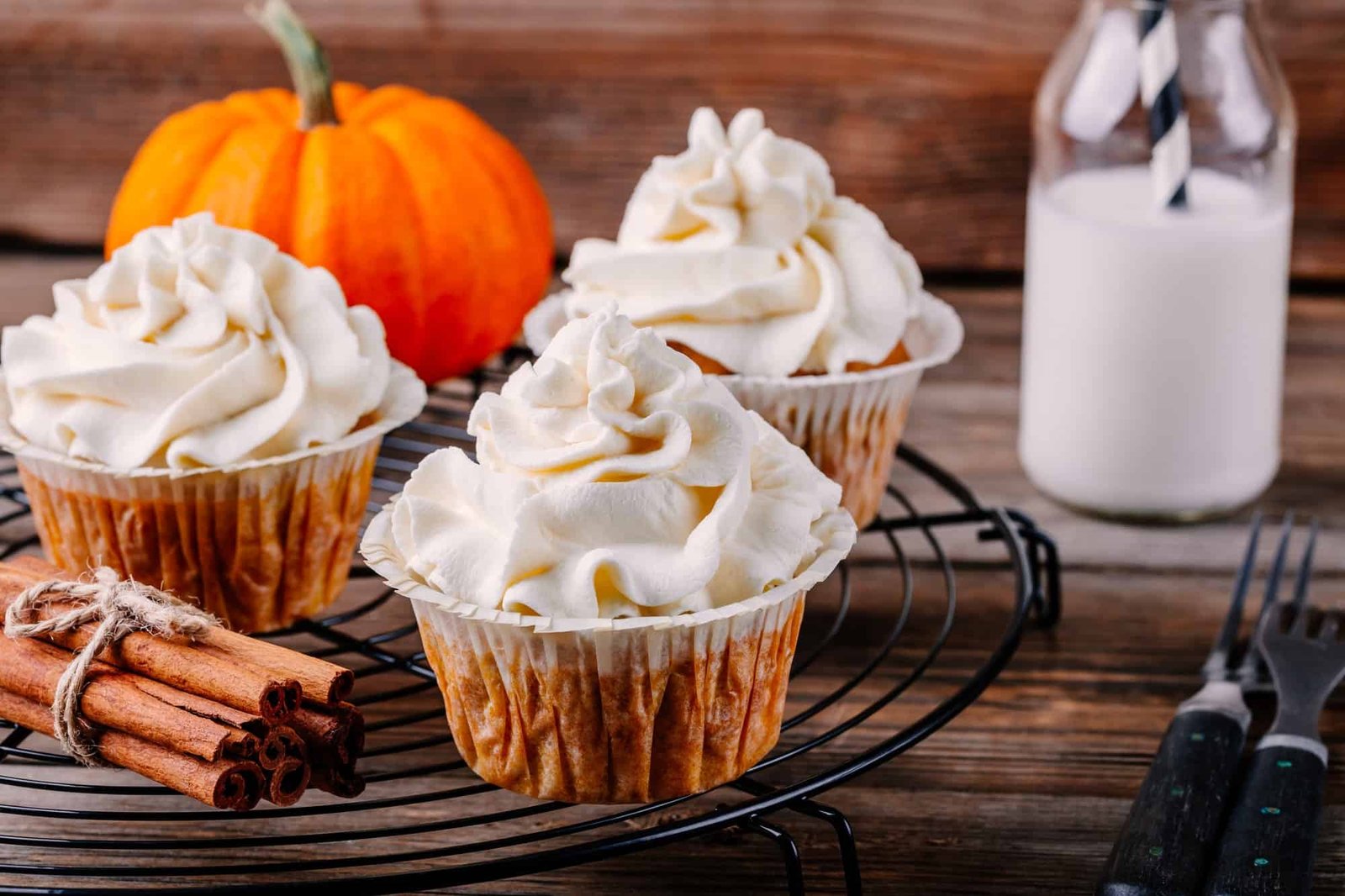 Pumpkin cupcakes decorated with cream cheese frosting