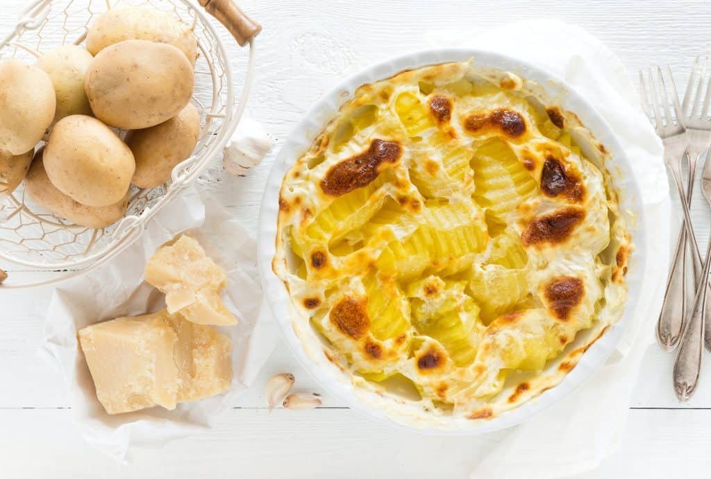 Baked potato gratin with garlic, cream and parmesan cheese