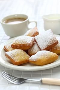 homemade new orleans beignet and a cup of coffee