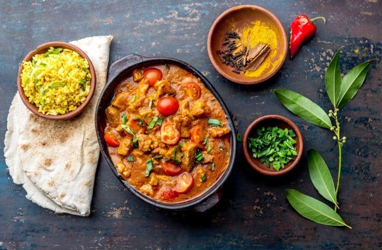 INDIAN FOOD. ROGAN JOSH curry sauce. Pork rogan josh with rice.