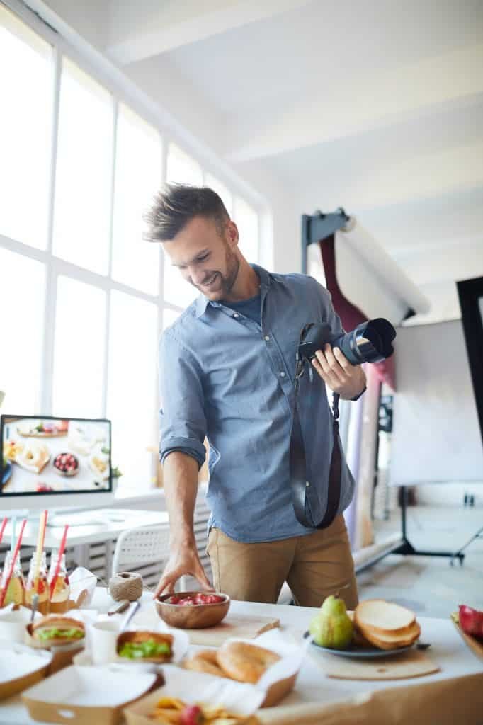 Photographer Setting Table in Studio