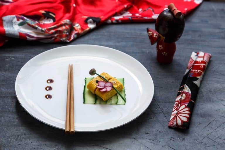 Traditional tamagoyaki Japanese omelette on on a plate, restaurant dish