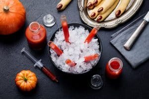 Bloody Mary Cocktail in Glass Tubes with Witch's Fingers Cookies for Halloween Party Celebration.