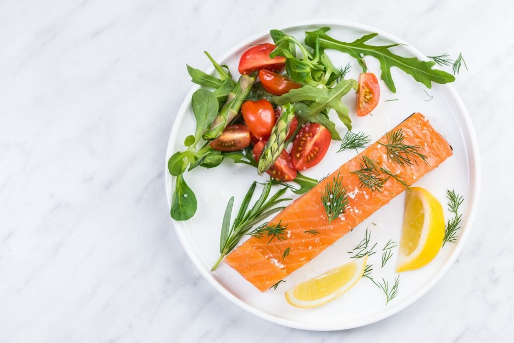 Serving cold smoked salmon fish, restaurant dish on plate