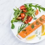 Serving cold smoked salmon fish, restaurant dish on plate