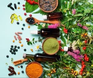 Holistic medicine approach. Healthy food eating, dietary supplements, healing herbs and flowers