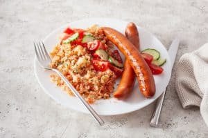 ketogenic paleo diet lunch. cauliflower rice and grilled sausages