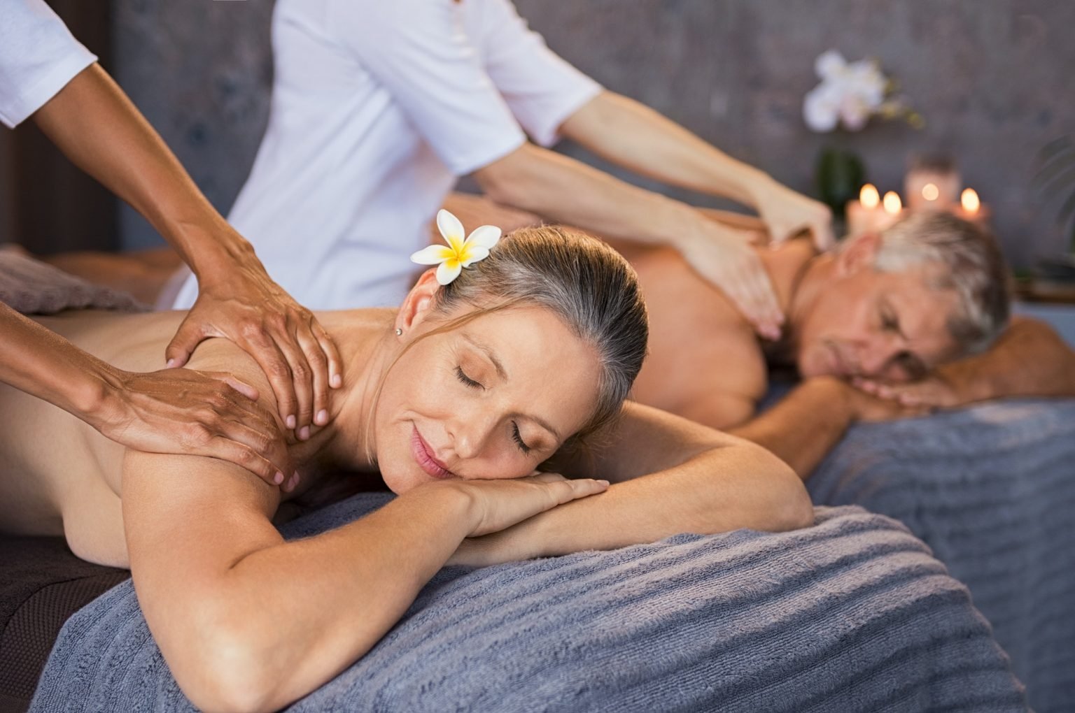 Mature couple having massage at spa
