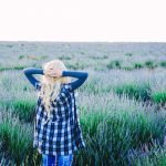 Young blonde woman alone in a lavender field