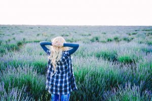 Young blonde woman alone in a lavender field