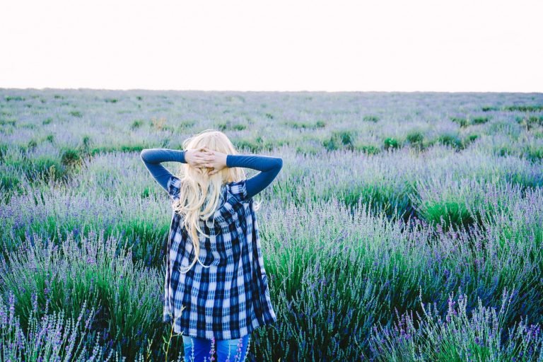 Young blonde woman alone in a lavender field