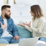 Young couple arguing about domestic bills at home