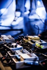 Guitar Pedals on a stage with live band performing during a Show
