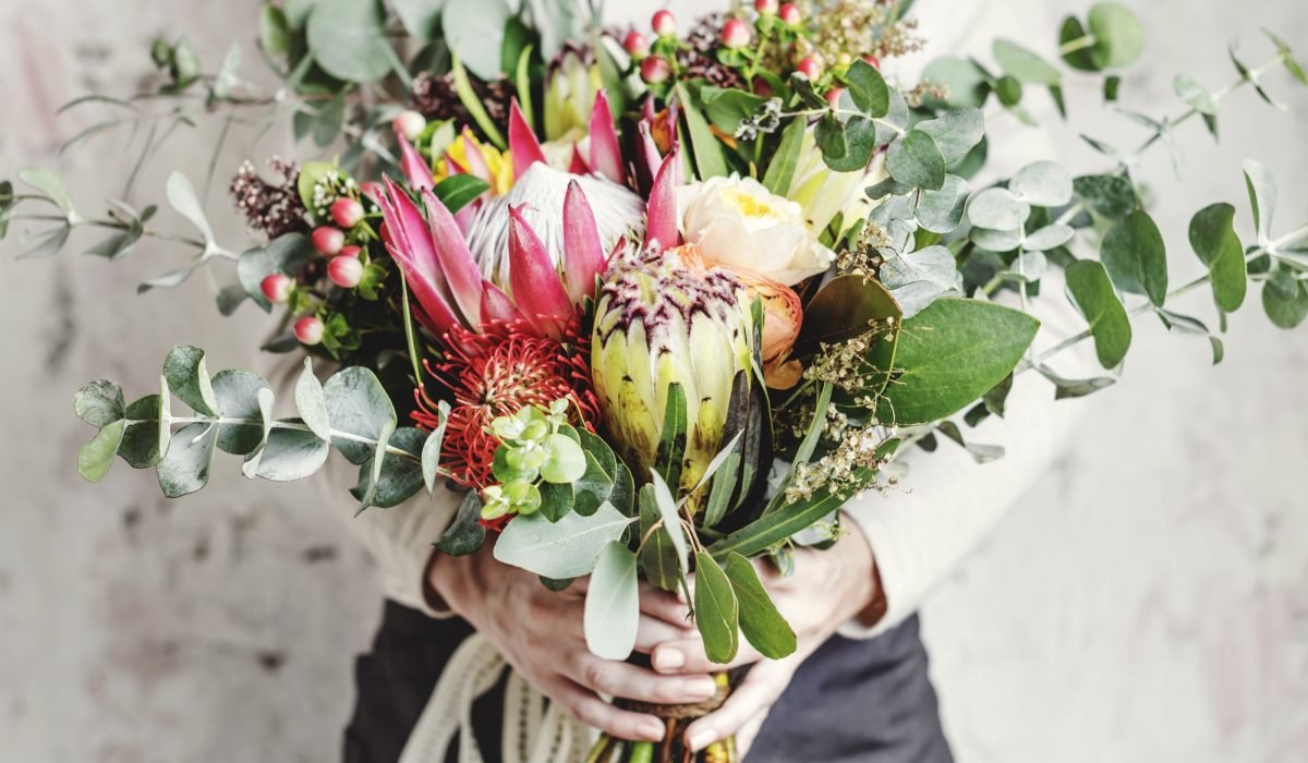 Woman Hands Holding Beautiful Flowers Bouquet
