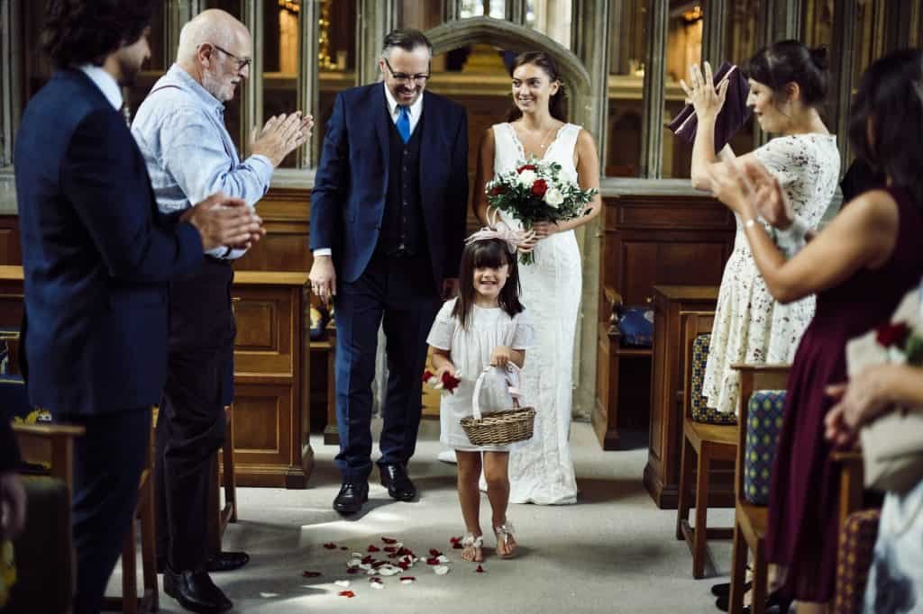 Flower girl walking down the aisle
