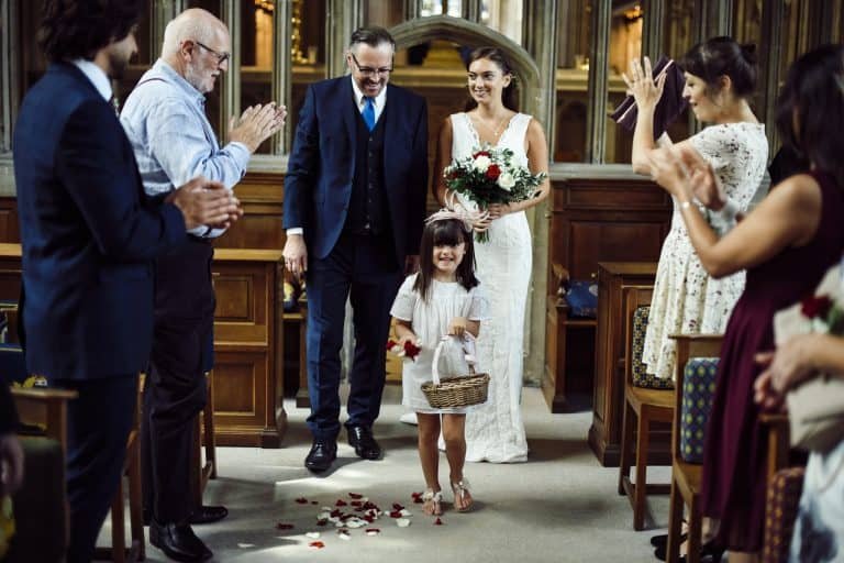 Flower girl walking down the aisle